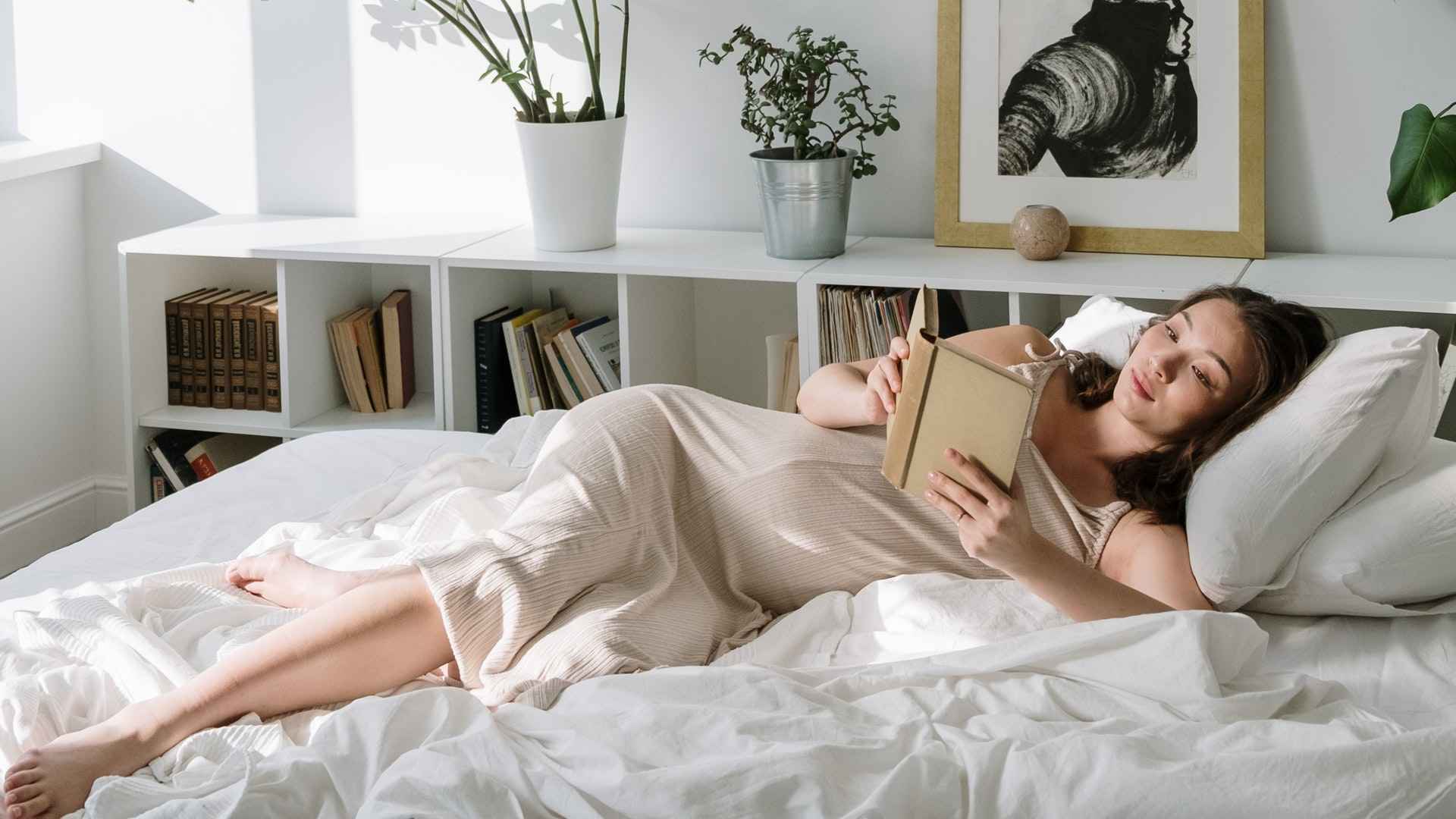 pure parima lady reading in bed