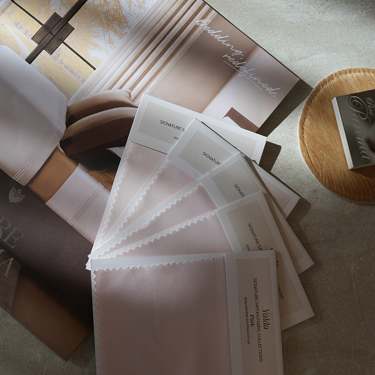 A styled flat-lay of multiple fabric swatch cards.